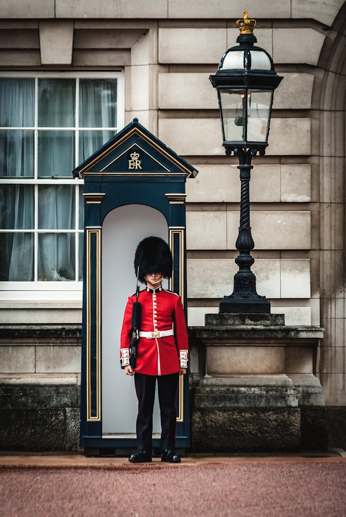 A traditional Queen's Guard standing at Buckingham Palace in London, England.