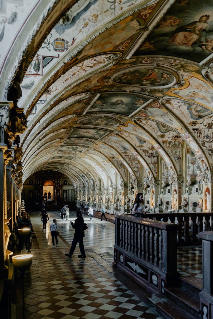 Explore the stunning interior of Munich's famous Residenz with its detailed arches and artwork.