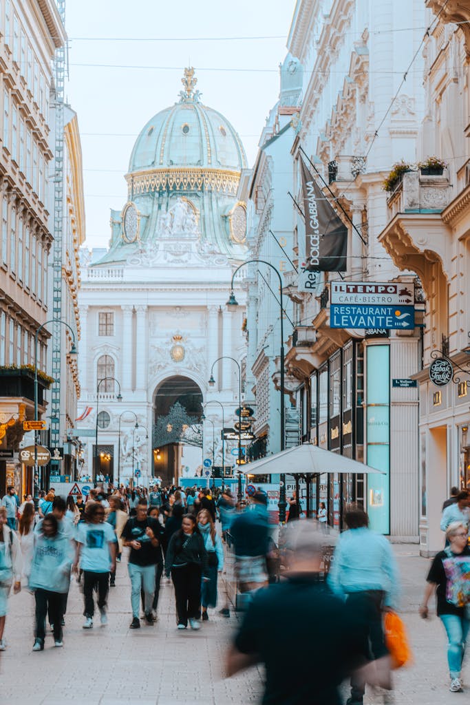 A busy street in Vienna with a view of historical architecture, capturing vibrant city life.