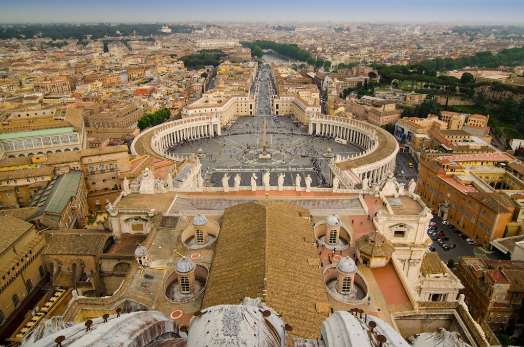 A captivating aerial view of Saint Peter's Basilica and Square in Vatican City, showcasing Roman architecture.