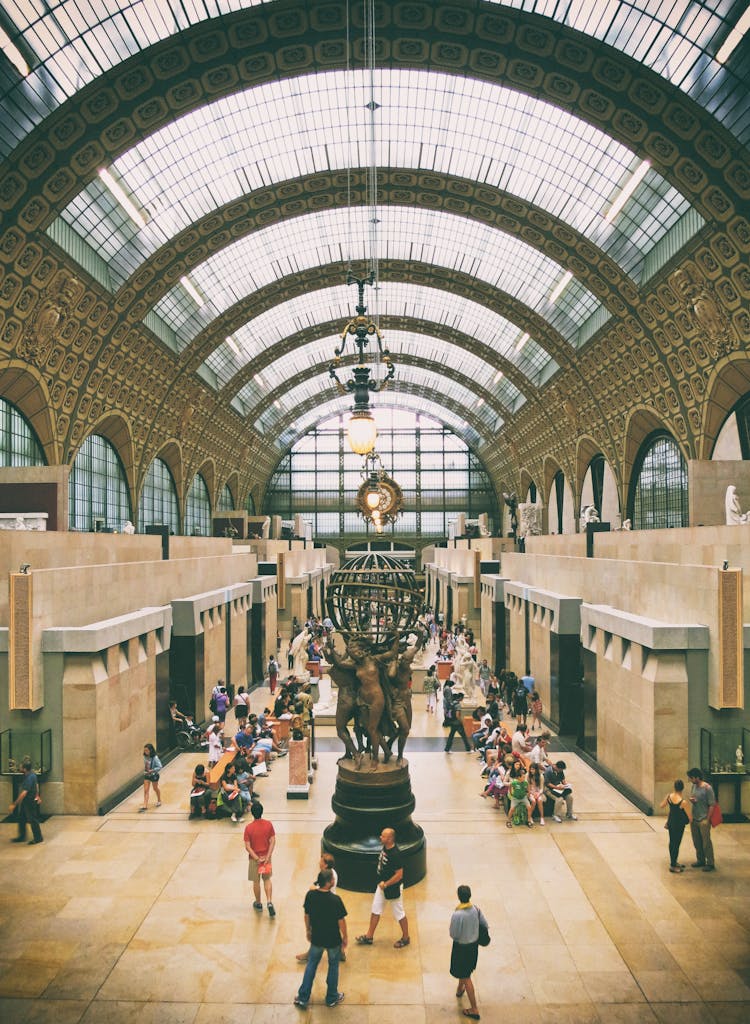 Explore the captivating architecture and vibrant atmosphere inside Musée d'Orsay, Paris.