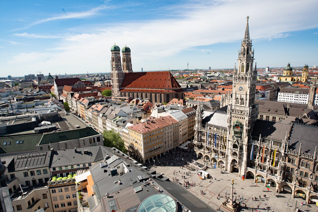 Majestic aerial view of Munich's Marienplatz and Frauenkirche showcasing historic architecture.