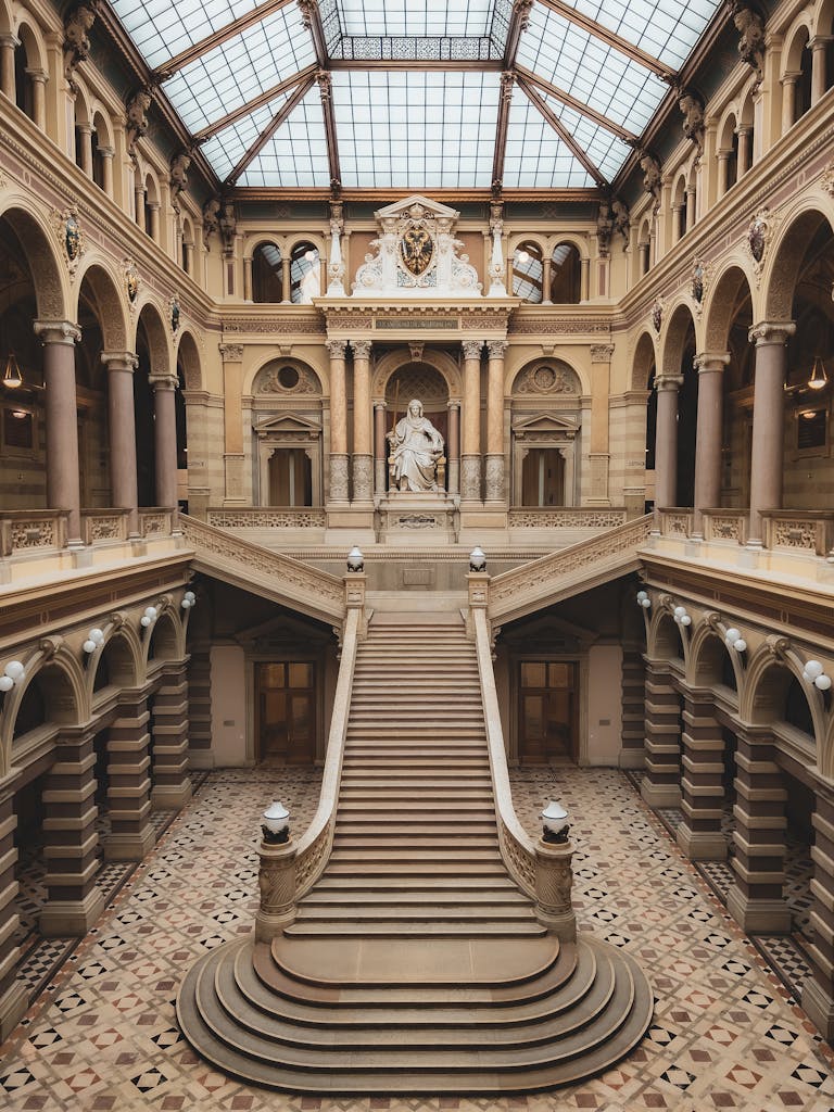 Majestic staircase inside a historic palace in Vienna, showcasing classic architecture.